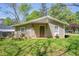 Side view of home's exterior, showing siding, small windows, and tidy landscaping at 1422 Cassville Nw Rd, Cartersville, GA 30121