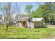 Home with tidy lawn plus metal roof and satellite dish at 1422 Cassville Nw Rd, Cartersville, GA 30121
