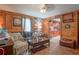 Comfortable living room with hardwood floors, wood paneling, and lots of windows for natural light at 1422 Cassville Nw Rd, Cartersville, GA 30121