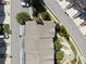 Birds-eye view of townhome featuring a detailed roof, landscaping, and surrounding neighborhood streets and parking at 2520 Carmel Way, Alpharetta, GA 30009
