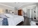 Bedroom featuring hardwood floors, white furniture, and an open concept office area at 2520 Carmel Way, Alpharetta, GA 30009
