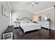 Bedroom features hardwood floors, vaulted ceiling, fan, white furniture, and a bench at 2520 Carmel Way, Alpharetta, GA 30009