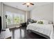 Bright bedroom featuring hardwood floors, vaulted ceiling, and large windows with peaceful outdoor view at 2520 Carmel Way, Alpharetta, GA 30009
