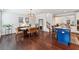 Elegant dining room with contemporary lighting, and large windows that fill the space with natural light at 2520 Carmel Way, Alpharetta, GA 30009