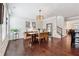 Bright dining room with modern lighting, hardwood floors, and ample space for Gathering gatherings and entertainment at 2520 Carmel Way, Alpharetta, GA 30009