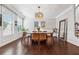 Bright dining room with large windows, stylish decor, and hardwood floors creating a welcoming atmosphere at 2520 Carmel Way, Alpharetta, GA 30009