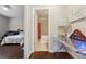 View from hallway into bathroom and bedroom showcasing the home's layout at 2520 Carmel Way, Alpharetta, GA 30009