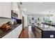Modern kitchen showcasing an island with seating, stainless steel appliances, and ample cabinet space at 2520 Carmel Way, Alpharetta, GA 30009