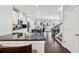 Spacious kitchen featuring stainless steel appliances, sleek countertops, and an island with seating, open to a dining area at 2520 Carmel Way, Alpharetta, GA 30009