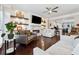 Inviting living room with a fireplace, built-in shelves, comfortable seating, and hardwood floors, for a relaxing atmosphere at 2520 Carmel Way, Alpharetta, GA 30009