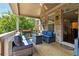 Covered patio with outdoor furniture and ceiling fan, perfect for relaxing at 2520 Carmel Way, Alpharetta, GA 30009