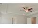 Spacious bedroom with trey ceilings and a ceiling fan for added comfort at 117 Compass Rd, Hampton, GA 30228