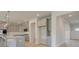Open concept kitchen with grey cabinetry, large island, modern appliances, and white countertops at 117 Compass Rd, Hampton, GA 30228