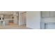 Open concept kitchen with grey cabinetry, island, white countertops, and modern stainless-steel appliances at 117 Compass Rd, Hampton, GA 30228