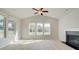 Bright living room with fireplace, vaulted ceiling, and large windows at 117 Compass Rd, Hampton, GA 30228