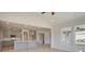 View of a kitchen adjacent to a naturally lit living room area at 117 Compass Rd, Hampton, GA 30228