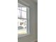 Bright room featuring a large window with white trim, offering a view of the neighborhood at 117 Compass Rd, Hampton, GA 30228