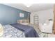 Comfortable bedroom featuring a crib, a Harmon wall decoration, and neutral tones at 2115 Bentbrooke Trl, Lawrenceville, GA 30043