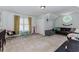 Spacious bonus room with ample lighting, playroom accents, and comfortable seating at 2115 Bentbrooke Trl, Lawrenceville, GA 30043
