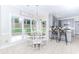 Cozy breakfast nook with backyard views and a glimpse into the updated kitchen space at 2115 Bentbrooke Trl, Lawrenceville, GA 30043