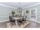 Elegant dining room with a modern chandelier, decor, and natural light from the windows at 2115 Bentbrooke Trl, Lawrenceville, GA 30043