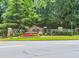 The Preserve community entrance with lush landscaping and decorative stone signage at 2115 Bentbrooke Trl, Lawrenceville, GA 30043