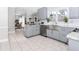 Open concept kitchen with stainless steel appliances and a view into an adjoining living space at 2115 Bentbrooke Trl, Lawrenceville, GA 30043