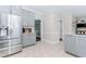 Modern kitchen design with grey cabinets, stainless steel refrigerator, and tile flooring at 2115 Bentbrooke Trl, Lawrenceville, GA 30043