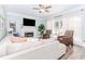 Cozy living room with a fireplace, large sectional sofa, two accent chairs, and ample natural light at 2115 Bentbrooke Trl, Lawrenceville, GA 30043