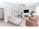 Stylish living room featuring a fireplace, comfortable seating, and large windows that provide ample natural light at 2115 Bentbrooke Trl, Lawrenceville, GA 30043