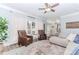 Inviting living room with a fireplace, comfortable seating, and a view into the dining area, perfect for relaxation at 2115 Bentbrooke Trl, Lawrenceville, GA 30043