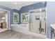 This main bathroom offers a soaking tub, glass shower, and neutral decor at 2115 Bentbrooke Trl, Lawrenceville, GA 30043