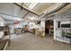 Finished basement with exercise equipment and storage shelving at 3737 Falls Trl, Winston, GA 30187