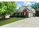 Charming two-story brick home with well-maintained lawn and an attached two-car garage at 3737 Falls Trl, Winston, GA 30187