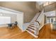 Open foyer with hardwood floors, staircase, and views into the dining and living areas at 3737 Falls Trl, Winston, GA 30187