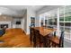 Breakfast nook next to open concept living room with fireplace and large windows at 3737 Falls Trl, Winston, GA 30187