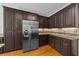 Bright kitchen featuring ample cabinetry, granite countertops, and stainless steel refrigerator at 3737 Falls Trl, Winston, GA 30187