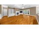 Bright living room features hardwood floors, fireplace, custom built-ins, and French doors at 3737 Falls Trl, Winston, GA 30187