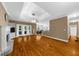 Spacious living room with hardwood floors, a fireplace, and a coffered ceiling at 3737 Falls Trl, Winston, GA 30187
