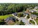 Aerial view of a neighborhood with lush greenery and well-maintained homes at 7198 Golfside Se Dr, Covington, GA 30014