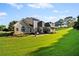 Expansive backyard with manicured lawn and patio area, perfect for outdoor living at 7198 Golfside Se Dr, Covington, GA 30014