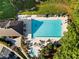 Overhead shot of the community pool with plenty of lounge chairs, tables, and parking spaces at 7198 Golfside Se Dr, Covington, GA 30014