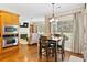 Cozy eat-in kitchen featuring hardwood floors and dining area at 7198 Golfside Se Dr, Covington, GA 30014