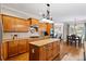 Well-appointed kitchen with stainless steel appliances, granite countertops and an island at 7198 Golfside Se Dr, Covington, GA 30014