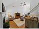 Comfortable living room with hardwood floors, high ceilings and large windows at 7198 Golfside Se Dr, Covington, GA 30014