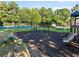 Community playground with swings, slides, and a picnic table, ideal for Gathering fun at 7198 Golfside Se Dr, Covington, GA 30014