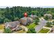 A high angle view showing a lovely home nestled in a lush, wooded suburban community at 2241 Chaseford Ln, Powder Springs, GA 30127