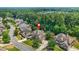 A high angle view showing a lovely home nestled in a lush, wooded suburban community at 2241 Chaseford Ln, Powder Springs, GA 30127