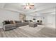 Spacious basement with gray sectional sofa, recessed lighting, and finished flooring at 2241 Chaseford Ln, Powder Springs, GA 30127
