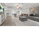 Finished basement featuring a large gray sectional, dining area, and modern decor at 2241 Chaseford Ln, Powder Springs, GA 30127